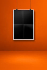 Digital composite image of empty orange wall