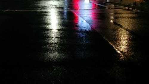 Surface level of wet road at night