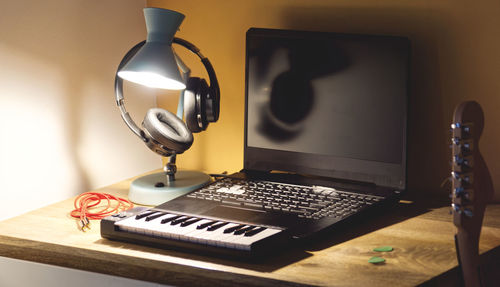 Close-up of electric lamp on table