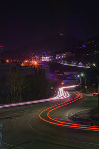 High angle view of light trails on road at night