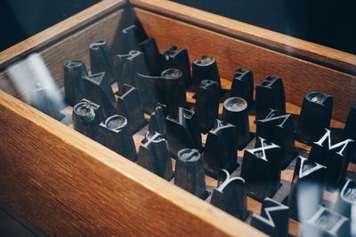 High angle view of printing press in wooden container