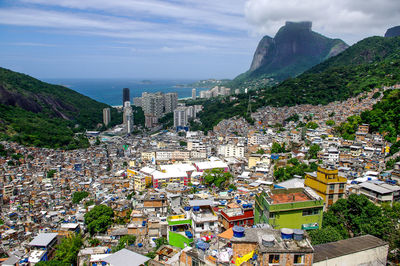 High angle view of city against cloudy sky