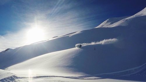 Scenic view of snow covered mountains against sky
