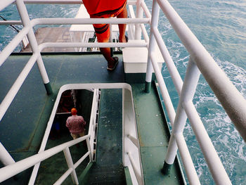 High angle view of girl sitting on boat