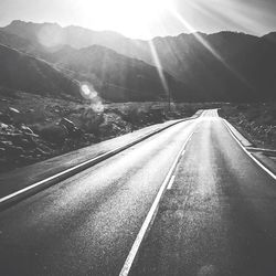 Country road leading towards mountains