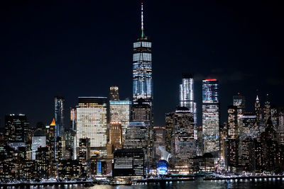 Low angle view of skyscrapers lit up at night