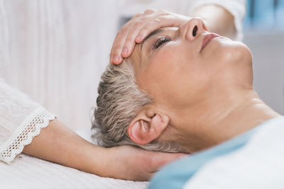 Close-up of woman getting massage at spa