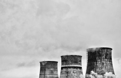 Low angle view of factory against sky