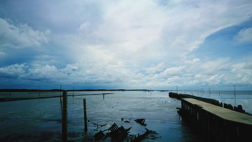 Pier over sea against sky