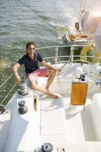 High angle view of man sitting in yacht