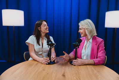 Portrait of young woman sitting at home