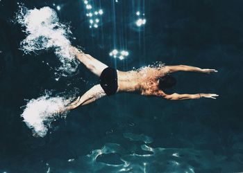 Woman swimming in pool