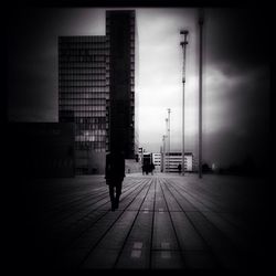 People walking in front of building