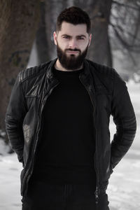 Portrait of young man standing outdoors