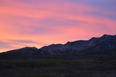 Scenic view of mountains against sky during sunset