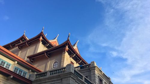 Low angle view of temple against blue sky