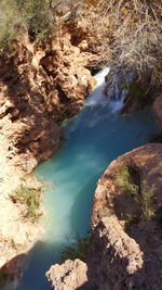 High angle view of rocks by river