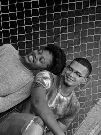 Portrait of smiling young man and woman outdoors