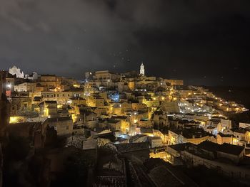 High angle view of illuminated buildings in city at night