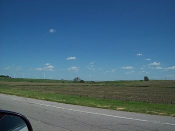 Road by landscape against clear sky