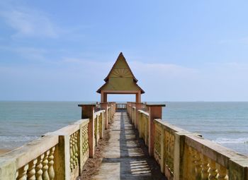 Lifeguard hut on beach against sky