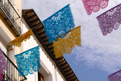 Low angle view of flags against building