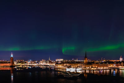 View of stockholm city with northern lights above