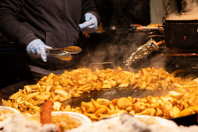 Fried potatoes on a large skillet.