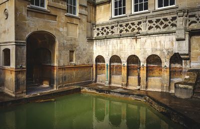 Reflection of old building in canal