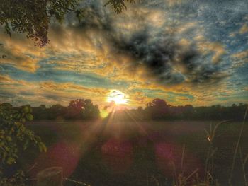 Scenic view of landscape against sky during sunset