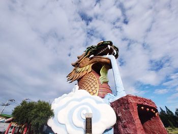 Low angle view of statue against sky