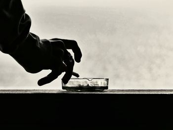 Low section of man against sky