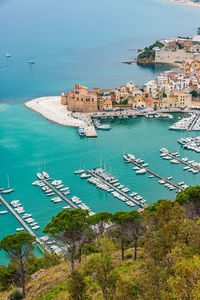 High angle view of townscape by sea