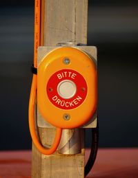 Close-up of information sign on pole