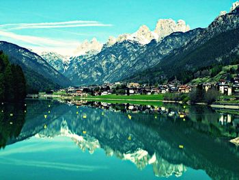 Scenic view of lake and mountains against sky