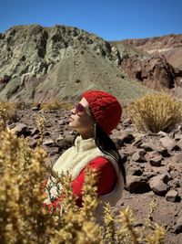 Rear view of woman standing on mountain