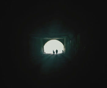 People walking in tunnel