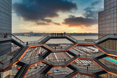 Low angle view of modern buildings against sky during sunset