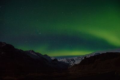 Scenic view of mountains against sky at night