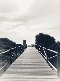 Footbridge against sky