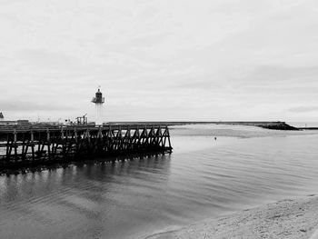 Pier over sea against sky