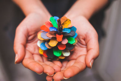 Cropped image of hand holding paper