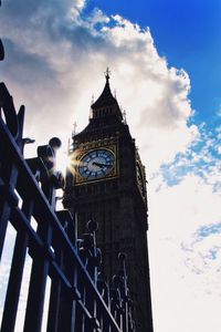 Low angle view of clock tower against sky