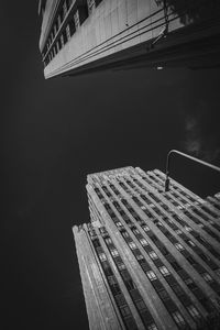 Low angle view of buildings against sky at night