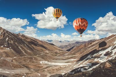 Low angle view of hot air balloons against sky