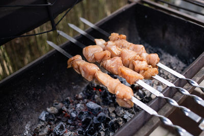 Close-up of meat on barbecue grill