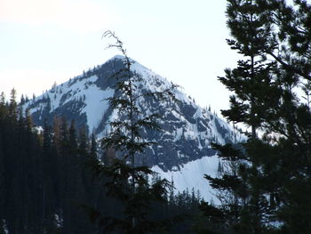 Low angle view of majestic mountains against clear sky