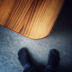 Low section of people standing on tiled floor