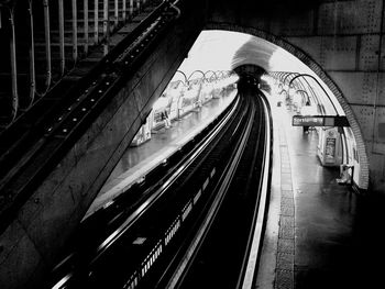 Blurred motion of train at railroad station