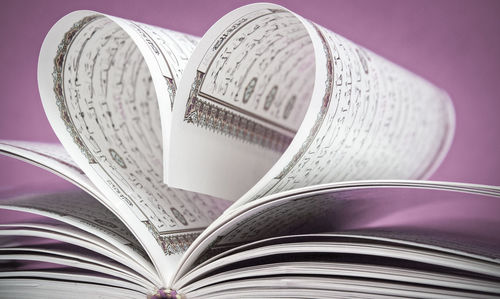 Close-up of heart shape on book